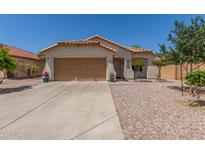 Charming single-story home featuring a two-car garage, low maintenance landscaping, and a terracotta tile roof at 2896 W Hayden Peak Dr, San Tan Valley, AZ 85144