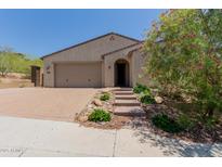Charming single-story home features a low-maintenance desert landscape and neutral color palette at 34009 N 29Th Dr, Phoenix, AZ 85085