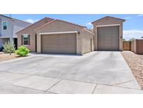 Charming single-story home with a three-car garage and a spacious driveway at 4091 W Suncup Dr, San Tan Valley, AZ 85144