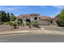 Charming single-story home featuring a tile roof, desert landscaping, and a welcoming front entrance at 4680 E Nightingale Ln, Gilbert, AZ 85298