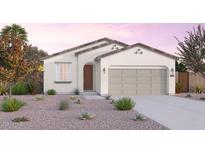Charming single-story home with a well-manicured front yard, neutral color palette, and an attached two-car garage at 12550 W Luxton Ln, Avondale, AZ 85323