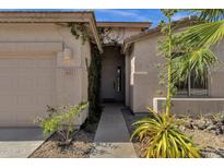 Inviting front entrance with desert landscaping and a walkway leading to the front door at 1641 W Windsong Dr, Phoenix, AZ 85045