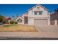 Two-story home featuring a tile roof, neutral paint, and a two-car garage at 16609 S 41St St, Phoenix, AZ 85048