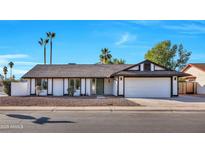 Charming single-story home featuring a low-maintenance desert landscape and an attached two-car garage at 1720 W Highland St, Chandler, AZ 85224