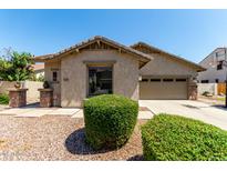 Charming single-story home featuring a low maintenance yard and attached two-car garage at 418 W Balsam Dr, Chandler, AZ 85248
