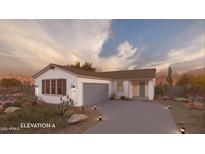 Charming single-story home showcasing desert landscaping, a grey garage door, and a welcoming front entrance at 17605 N Bolerno Dr, Maricopa, AZ 85138