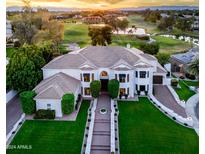 Beautiful exterior view of this home with lush landscaping and a view of the golf course at 3330 S Horizon Pl, Chandler, AZ 85248