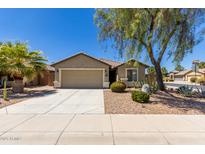 Charming single-Gathering home features a desert-landscaped front yard with a two-car garage and clear blue sky at 42022 W Cheyenne Dr, Maricopa, AZ 85138