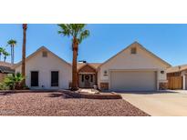 Charming single-story home with desert landscaping, neutral paint, and an attached two-car garage at 10029 S 44Th St, Phoenix, AZ 85044