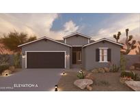 Charming single-story home featuring desert landscaping, a two-car garage, and a welcoming front entrance at 17595 N Bolerno Dr, Maricopa, AZ 85138