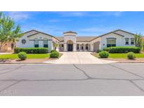 Stunning home showcasing a circular entryway, manicured landscaping, and a spacious driveway at 20115 E Sonoqui E Blvd, Queen Creek, AZ 85142