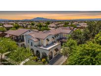 Beautiful two-story home with a tile roof and well-manicured landscaping, nestled in a vibrant community at 20437 W White Rock Rd, Buckeye, AZ 85396