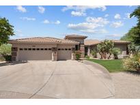 Inviting single story home with large driveway, three-car garage, and desert landscaping at 31234 N 47Th Pl, Cave Creek, AZ 85331