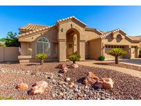 Stunning single-story home with a welcoming entrance and low maintenance desert landscaping at 5731 W Gail Dr, Chandler, AZ 85226