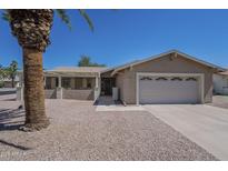 Charming single-story home featuring desert landscaping, a covered front patio, and an attached two-car garage at 906 Leisure World --, Mesa, AZ 85206