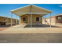 Charming single-story home with covered parking and desert landscaping at 9431 E Coralbell Ave # 60, Mesa, AZ 85208