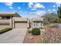 Charming single-level home with a desert-style front yard and two car garage at 12642 N Mountainside Dr # D, Fountain Hills, AZ 85268