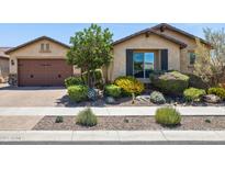 Charming single story home with colorful landscaping and a two car garage at 33305 N 26Th Ave, Phoenix, AZ 85085