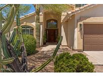 Charming single-Gathering home with desert landscaping and a quaint front entrance at 4402 E Barwick Dr, Cave Creek, AZ 85331
