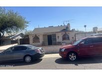Charming single-story home featuring unique architectural details and convenient street parking at 2133 W Wilshire Dr, Phoenix, AZ 85009