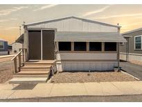 Charming single-story home featuring a covered entry and neatly maintained gravel landscaping at 2701 E Allred Ave # 171, Mesa, AZ 85204