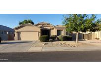 Beautiful one-story home featuring a two-car garage and desert landscaping at 3247 E Lark Ct, Gilbert, AZ 85297
