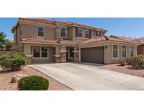 Stunning two-story home with a well-manicured front yard and a spacious driveway leading to a two-car garage at 4102 E Palm Beach Dr, Chandler, AZ 85249