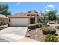 Charming single-story home with a well-manicured front yard and a two-car garage at 5024 S Citrus Ct, Gilbert, AZ 85298