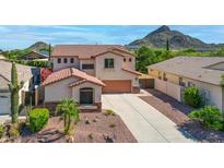 Charming two-story home with a well-maintained desert landscaped front yard and a spacious driveway at 6014 W Oberlin Way, Phoenix, AZ 85083