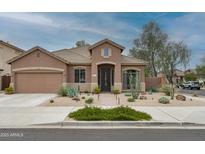 Charming single-story home featuring desert landscaping, a tile roof, and inviting curb appeal at 2221 W Calle De Las Estrella Way, Phoenix, AZ 85085