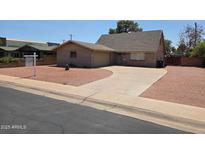 Charming single-story brick home featuring a paved driveway and low-maintenance desert landscaping at 4112 S Grandview Ave, Tempe, AZ 85282