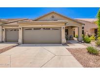 Charming single-story home featuring a two-car garage, landscaped yard, and covered entryway at 16821 S 23Rd St, Phoenix, AZ 85048