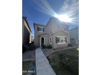Charming two-story home features a well-maintained yard and inviting walkway under a bright, sunny sky at 1814 W Minton St, Phoenix, AZ 85041