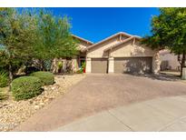 Charming home featuring a paved driveway and a well-maintained front yard at 27713 N 57Th Dr, Phoenix, AZ 85083