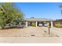 Charming single-story home with desert landscaping and a covered parking area for two vehicles at 3505 S Westfall Ave, Tempe, AZ 85282