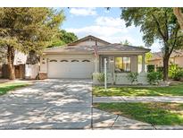 Charming single-Gathering home featuring a well-maintained front yard and an attached two-car garage at 3534 E Linda Ln, Gilbert, AZ 85234
