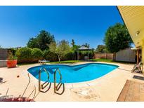 Backyard pool featuring a diving board, desert landscaping and a gazebo for outdoor entertaining at 9714 N 55Th Dr, Glendale, AZ 85302