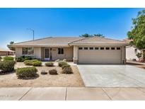 Charming single-story home features a low-maintenance landscape, neutral color palette and an attached two-car garage at 11033 E Keats Ave, Mesa, AZ 85209