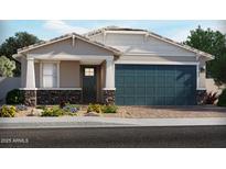 Charming single-story home featuring stone accents, a blue garage door, and a well-maintained front yard at 17595 W Monroe St, Goodyear, AZ 85338