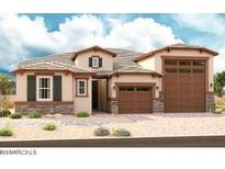 Charming single-story home with a three-car garage, stone accents, neutral colors, and well-maintained landscaping at 20158 W Monterey Way, Buckeye, AZ 85396