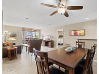 Spacious living and dining area featuring neutral tones and access to an outdoor balcony at 4200 N Miller Rd # 408, Scottsdale, AZ 85251