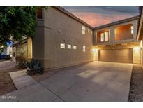 Beautiful two-story home featuring a spacious driveway, garage, and balcony at 9350 W Williams St, Tolleson, AZ 85353