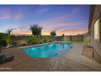 Inviting backyard pool with a private fence line, perfect for relaxing and entertaining outdoors at 21075 E Estrella Rd, Queen Creek, AZ 85142