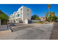 Modern townhomes boast a sleek, contemporary design with gated entries and a well-maintained exterior at 2130 E Turney Ave # 4, Phoenix, AZ 85016