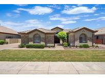 Charming single-story home featuring stone accents, a tile roof, and manicured landscaping at 2370 W Maplewood St, Chandler, AZ 85286