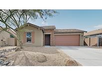 Charming single-story home with a two-car garage and desert landscaping at 23853 W Hammond Ln, Buckeye, AZ 85326