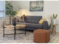 Comfortable living room with stylish decor, modern furnishings, and natural light at 7261 E Norland St, Mesa, AZ 85207