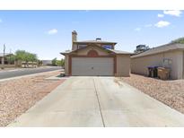 Traditional two-story home with a two-car garage and low maintenance desert landscaping at 8876 W Bluefield Ave, Peoria, AZ 85382