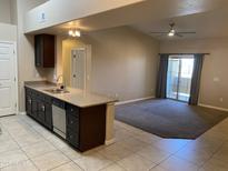 Bright kitchen with granite countertops and stainless steel appliances, open to the living space at 10136 E Southern Ave # 3109, Mesa, AZ 85209