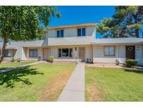 Charming two-story townhouse with well-maintained lawn and inviting curb appeal in a sunny location at 1061 E Fremont Dr, Tempe, AZ 85282